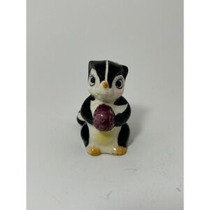 Vintage Ceramic Skunk Figurine Holding Purple Berry Mid Century Shaker